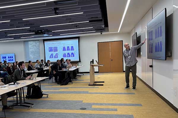 Presenter pointing at monitor during FSU-ORNL Workshop 